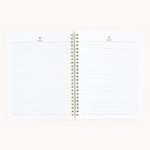 The Simplified Workbook - Finances is a spiral-bound notebook with lined pages labeled Notes at the top, ideal for tracking financial goals. It is set against a plain, light background.