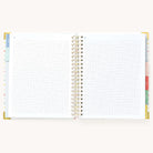 Simplified Homeschool Planner by Emily Ley open to a two-page grid notes spread. Features blank graph paper.