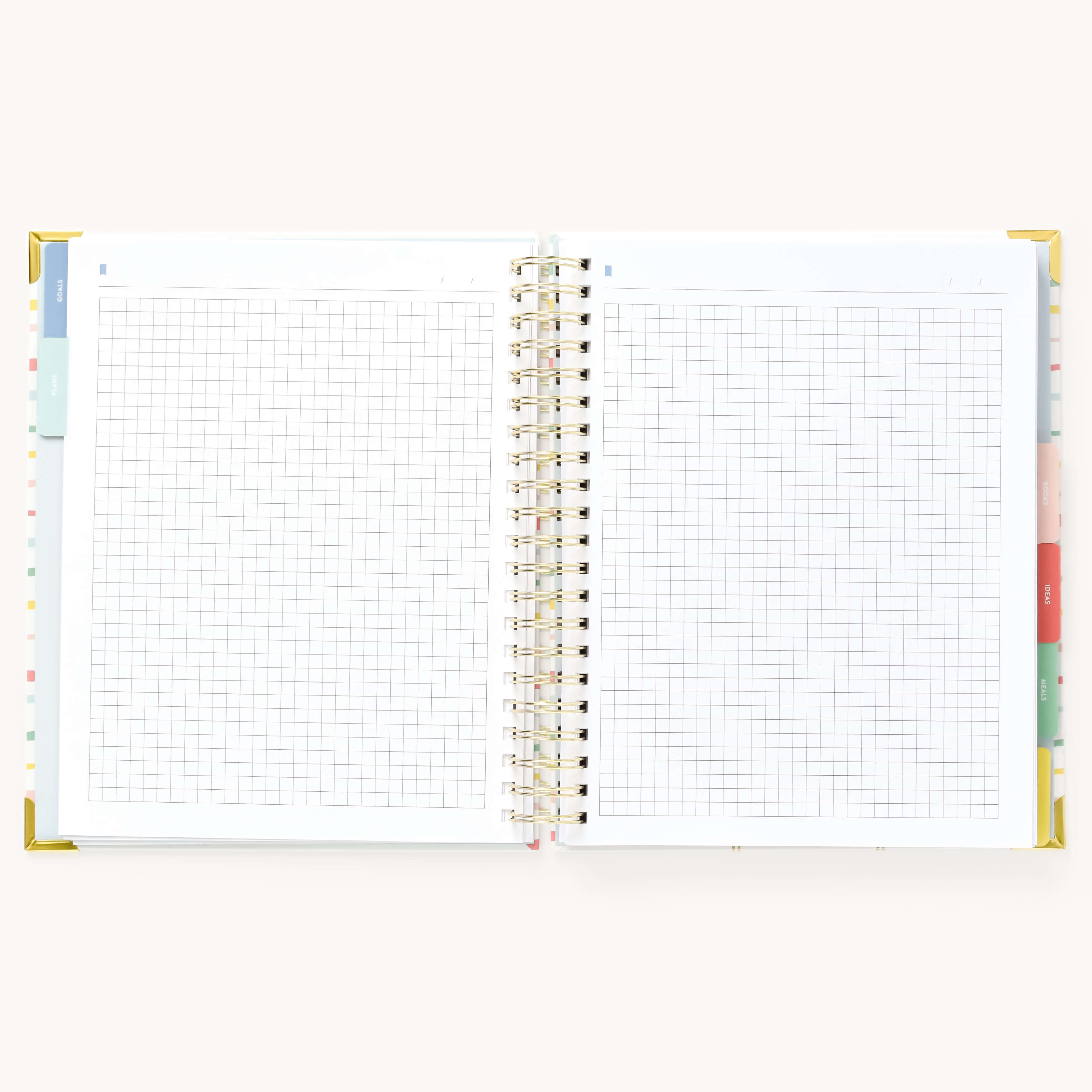 Simplified Homeschool Planner by Emily Ley open to a two-page grid notes spread. Features blank graph paper.