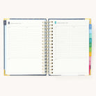 2025 Daily Simplified Planner by Emily Ley in the Dainty Dot cover design open to a two-page daily spread featuring Monday and Tuesday. Features a clean, minimalistic design with lined sections for daily tasks, to-do lists, and notes. Includes color-coded weekday labels, durable spiral binding, and gold corner protectors. 