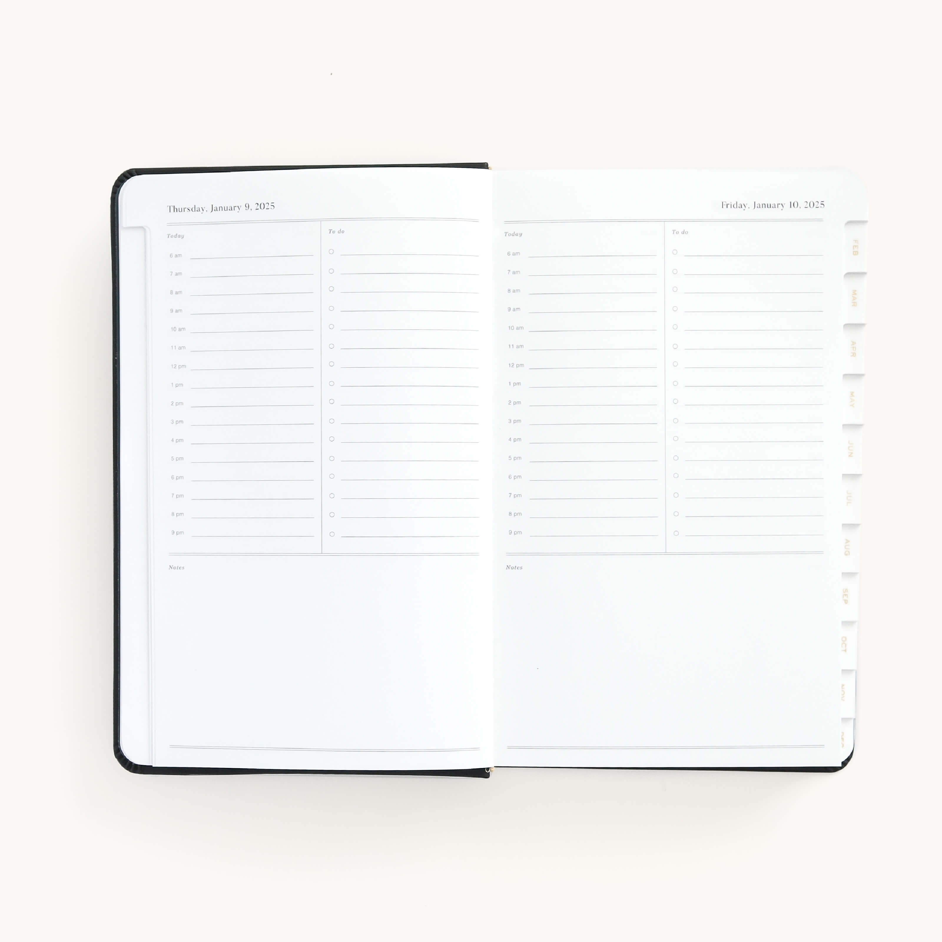 2025 Daily Dapperdesk Planner by Emily Ley in the Black Tie leatherette cover open to a two-page daily spread featuring Thursday and Friday. Features a clean, minimalistic design with lined sections for daily tasks, to-do lists, and notes.