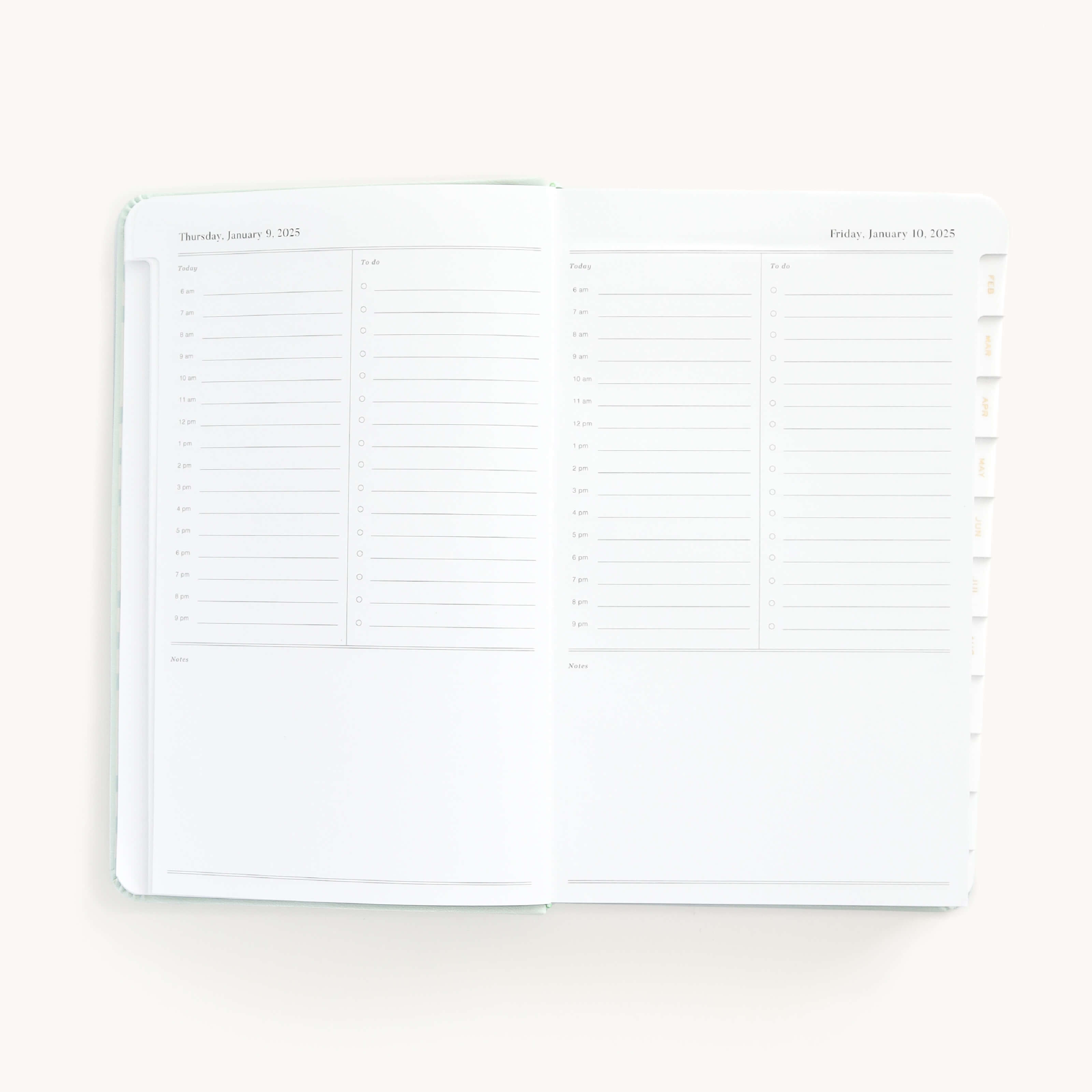 2025 Daily Dapperdesk Planner by Emily Ley in the Sea Salt leatherette cover open to a two-page daily spread featuring Thursday and Friday. Features a clean, minimalistic design with lined sections for daily tasks, to-do lists, and notes.