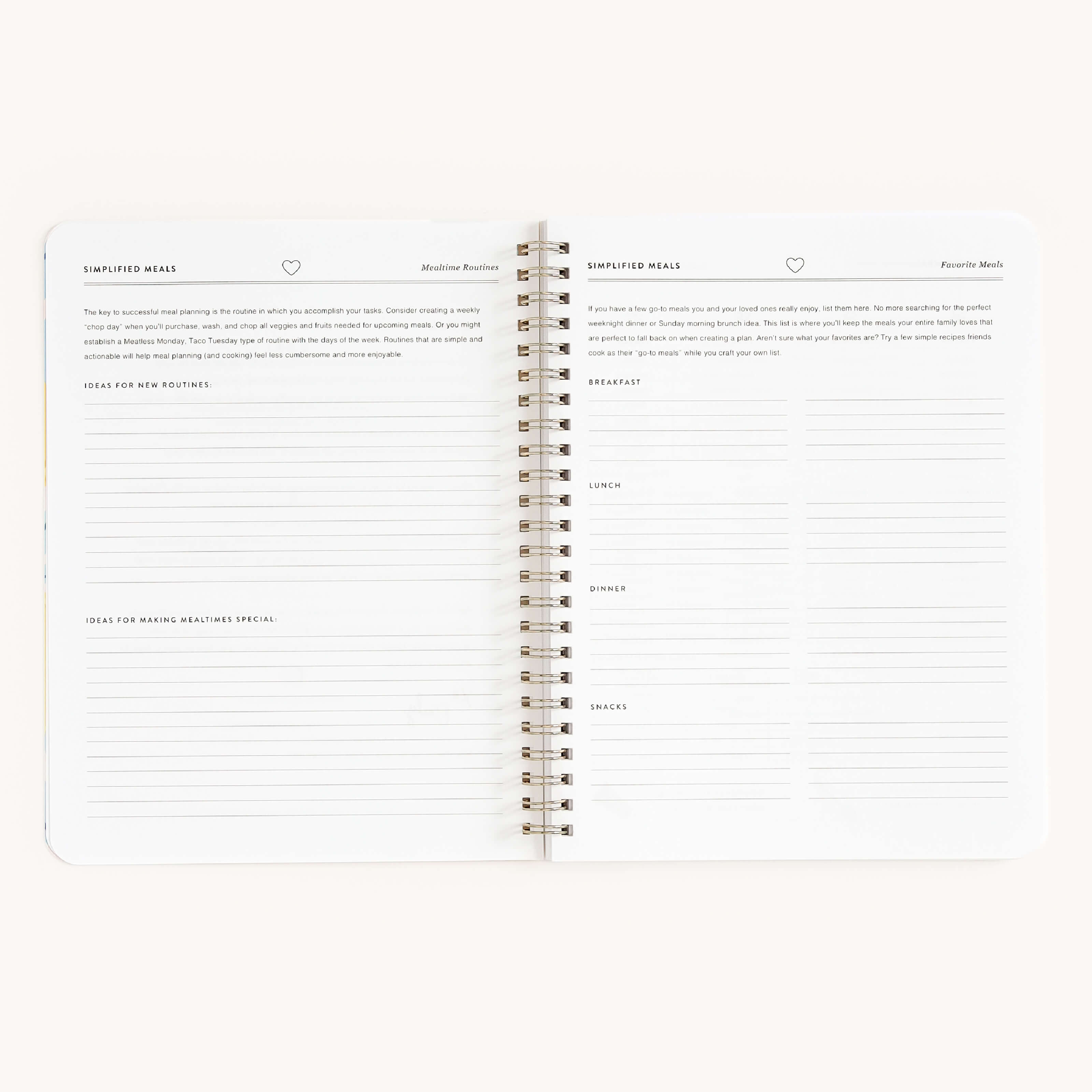 The Simplified open spiral-bound planner includes Simplified Ideas and the Workbook - Meal Planning, with the left page for routine and holiday ideas, and the right page for organizing breakfast, lunch, dinner, and snacks to simplify grocery shopping.