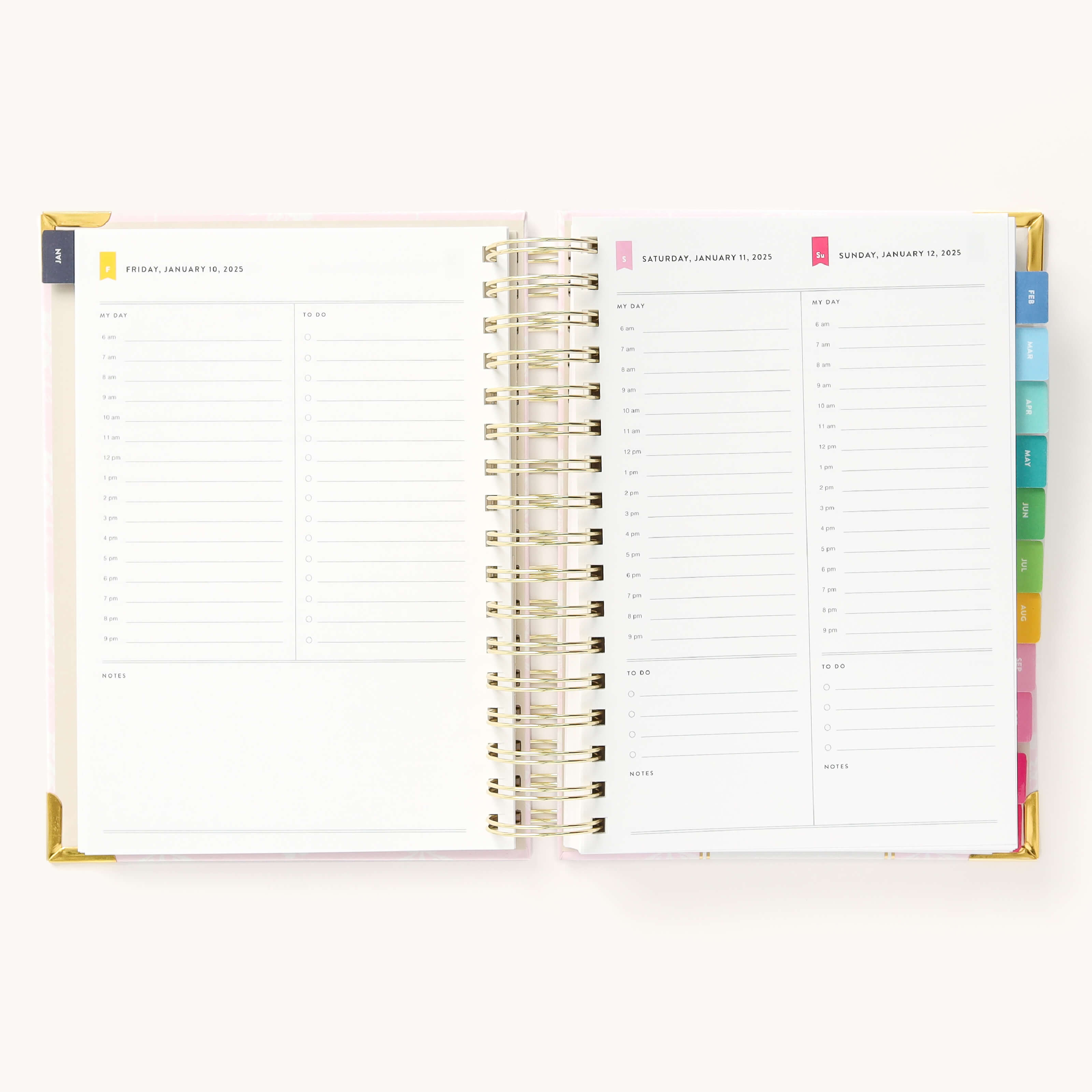 2025 Daily Simplified Planner by Emily Ley in the Blush Block cover design open to a two-page weekend spread. Features a clean, minimalistic design with lined sections for daily tasks, to-do lists, and notes. Includes color-coded weekday labels, durable spiral binding, and gold corner protectors. 