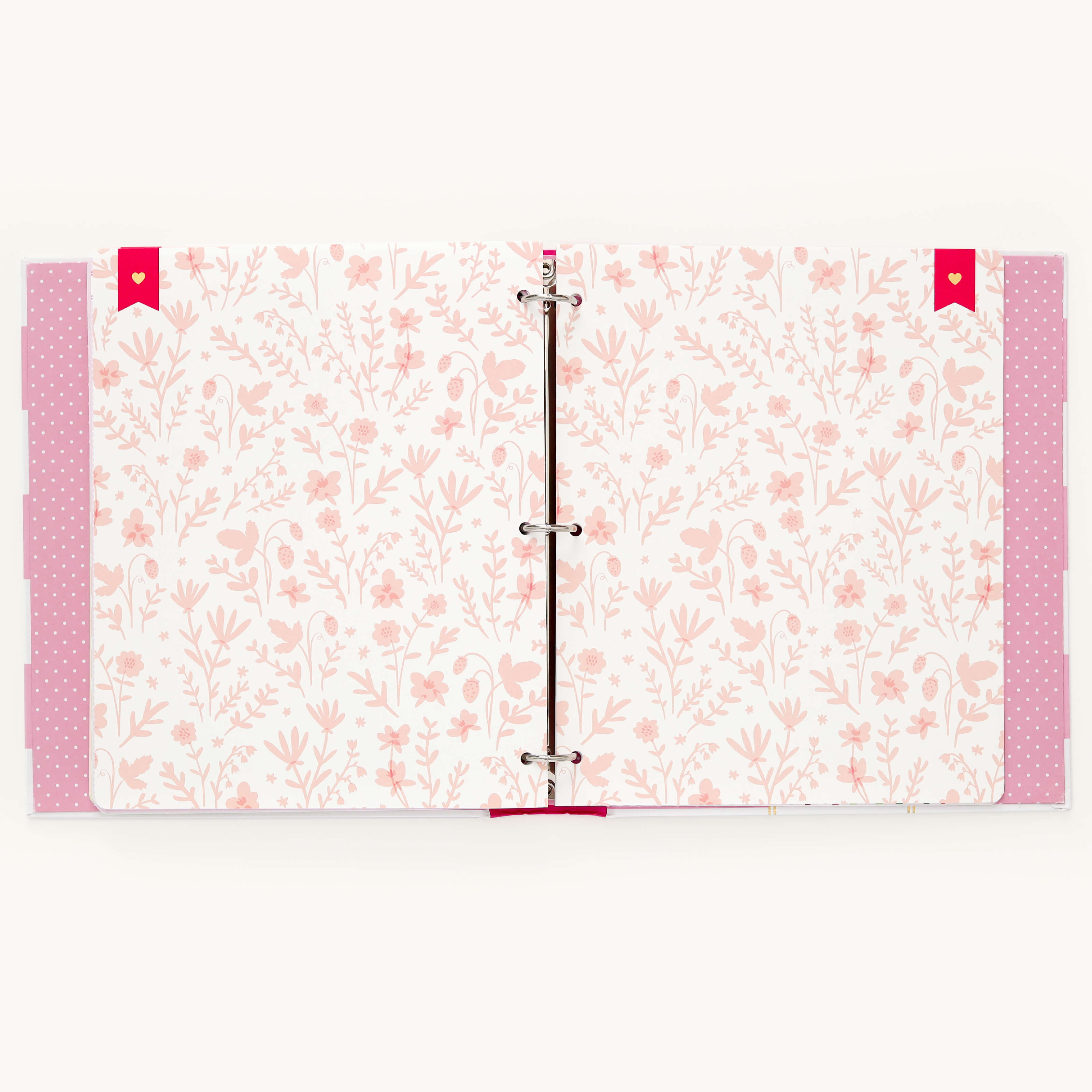 An open binder from Simplifieds Raspberry Big Kid Book reveals pages with a pink floral pattern on white, perfect for a childs adventures. Pink polka dot dividers add charm, making it ideal.