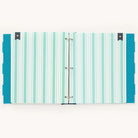 The Simplified Big Kid Book - Teal binder includes turquoise and white striped paper, teal dividers with white polka dots, and dark blue tabs topped with gold heart accents.