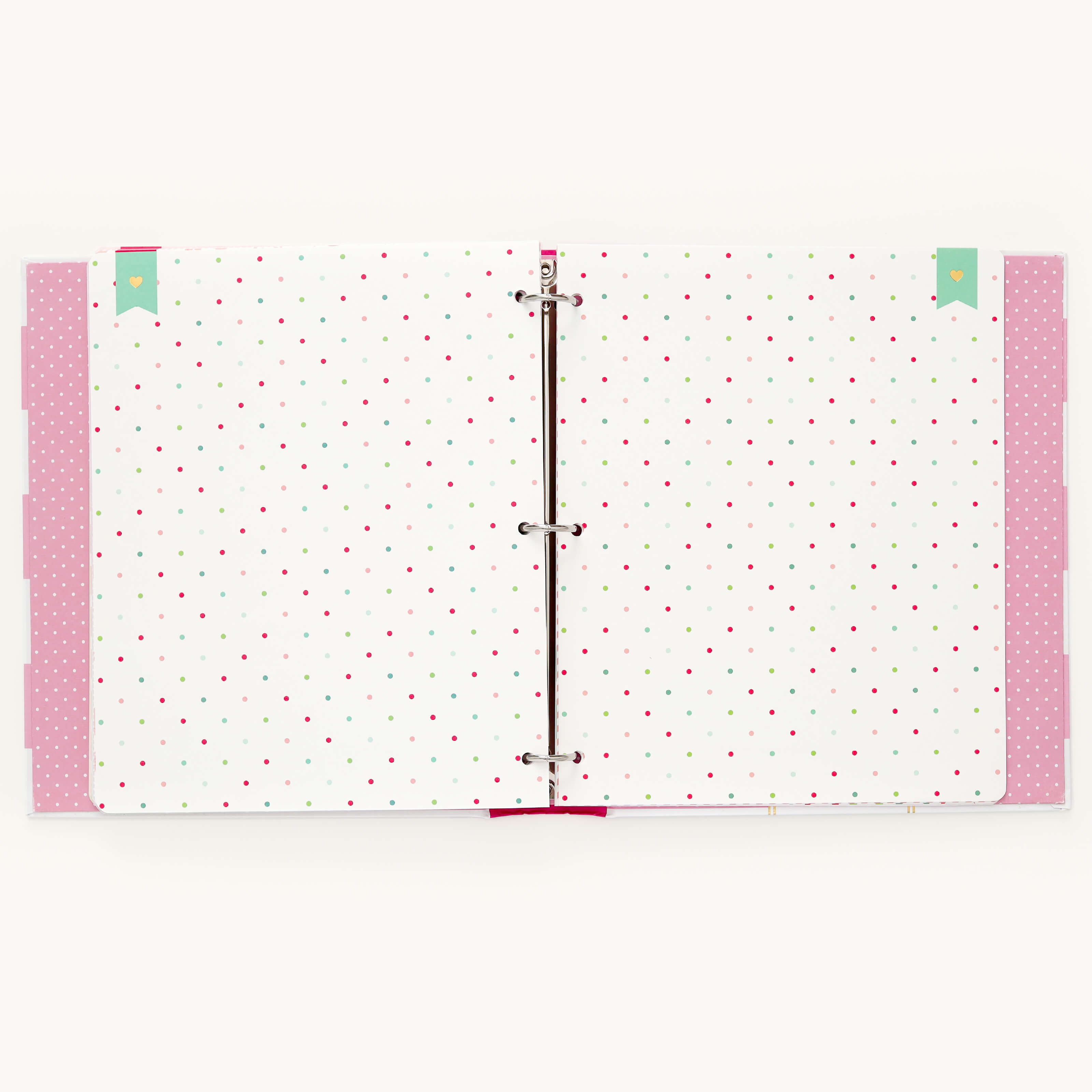 The Big Kid Book - Raspberry by Simplified displays two colorful pages with a playful polka dot pattern in red, green, and peach on white. Ideal for a childs adventures, it includes pink tabs and vibrant green and pink page markers at the top corners.