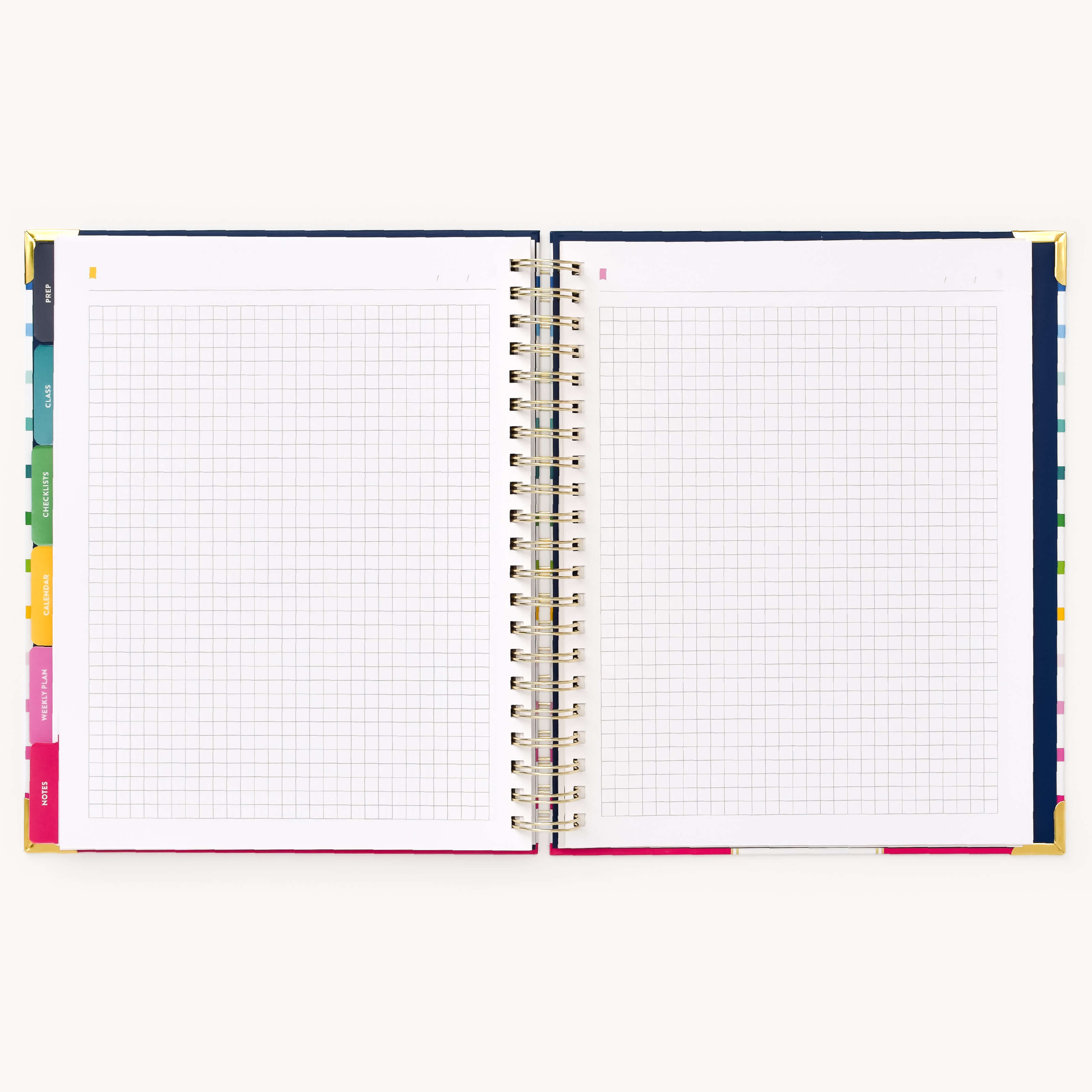 The Undated Teacher Planner - Happy Stripe by Simplified features colorful tabbed dividers, spiral binding, and graph paper pages perfect for lesson planning and tracking student progress. The mostly blank pages invite creativity, all set against a light background.