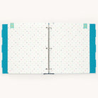 The Big Kid Book - Teal by Simplified is an open ring binder with a polka dot design and teal borders, perfect for capturing child growth milestones and adding a playful charm to memorable moments.