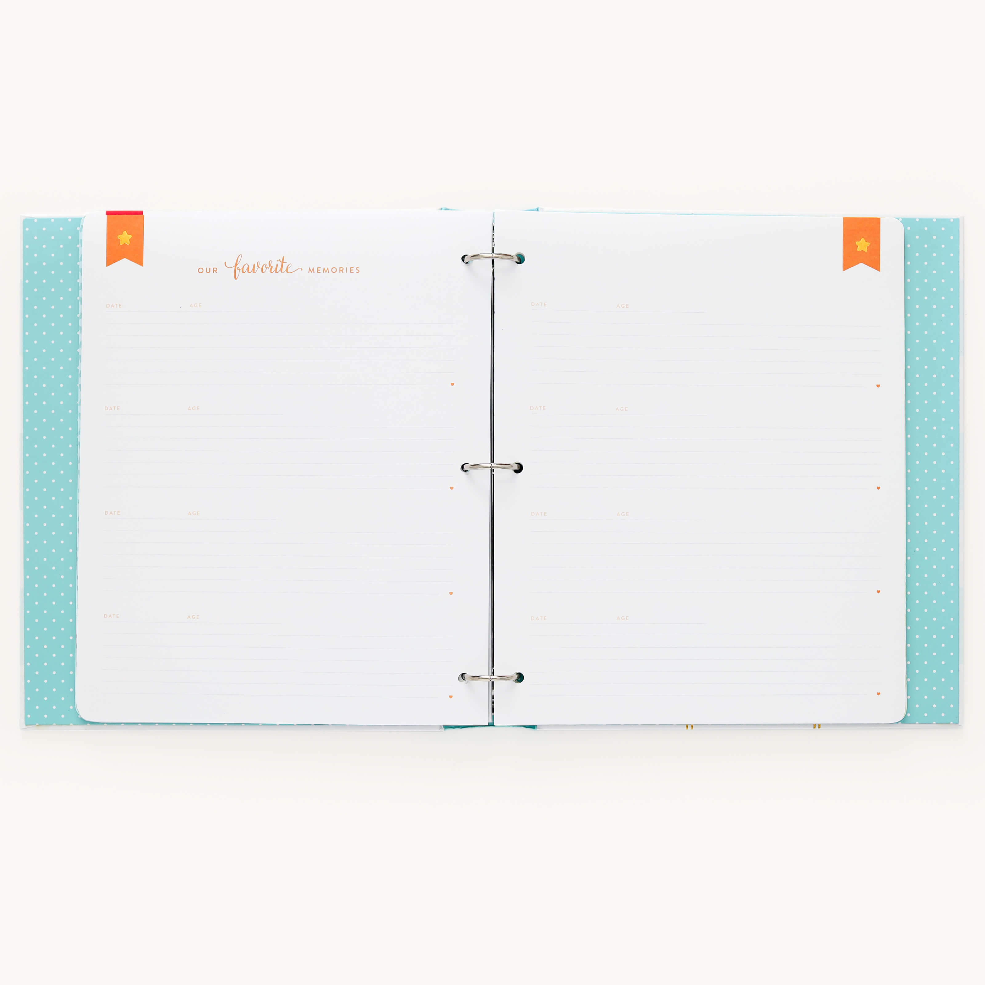 The Baby Book - Mint by Simplified features a light blue polka-dotted cover and metal rings. Inside, a customizable Our Favorite Memories page pack includes white pages with dotted lines for guided writing. Orange and red bookmark tabs help organize your precious moments.