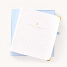 Simplified Wedding Planner displayed alongside its Carolina blue keepsake box with gold foil accents