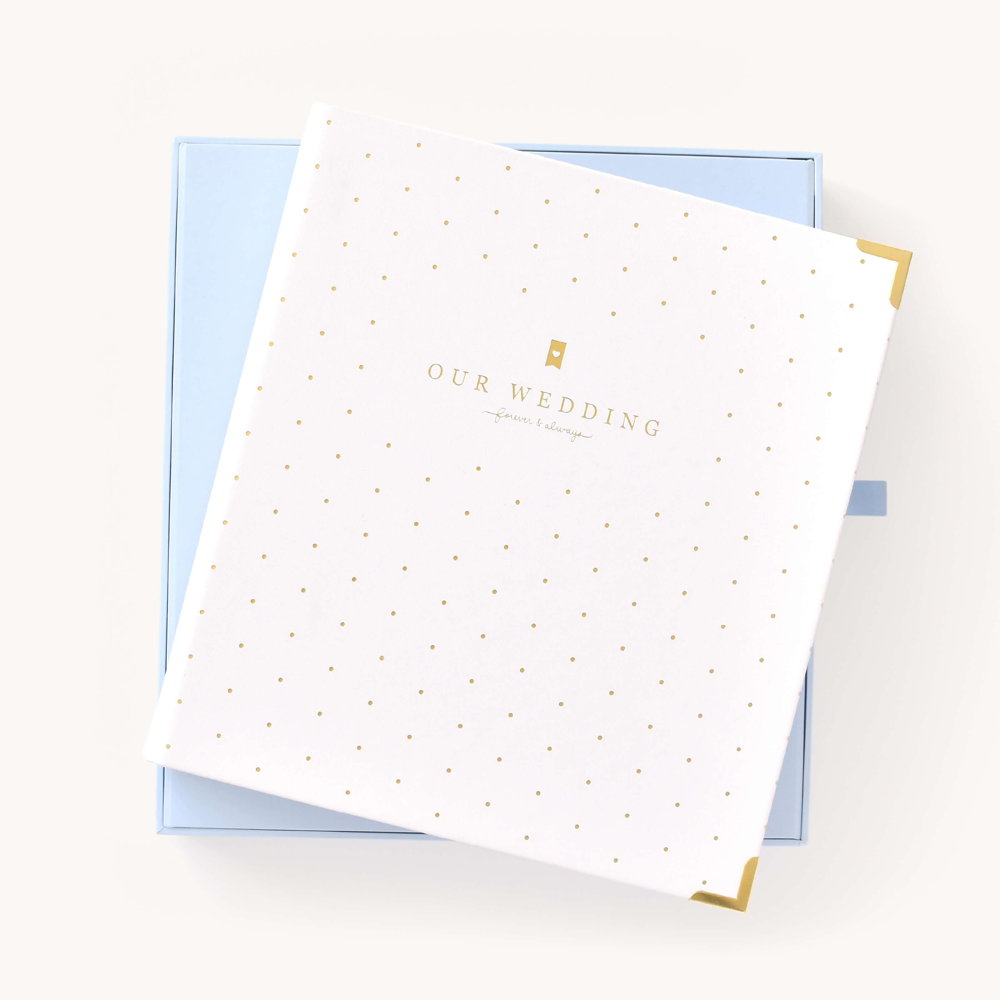 Simplified Wedding Planner displayed alongside its Carolina blue keepsake box with gold foil accents