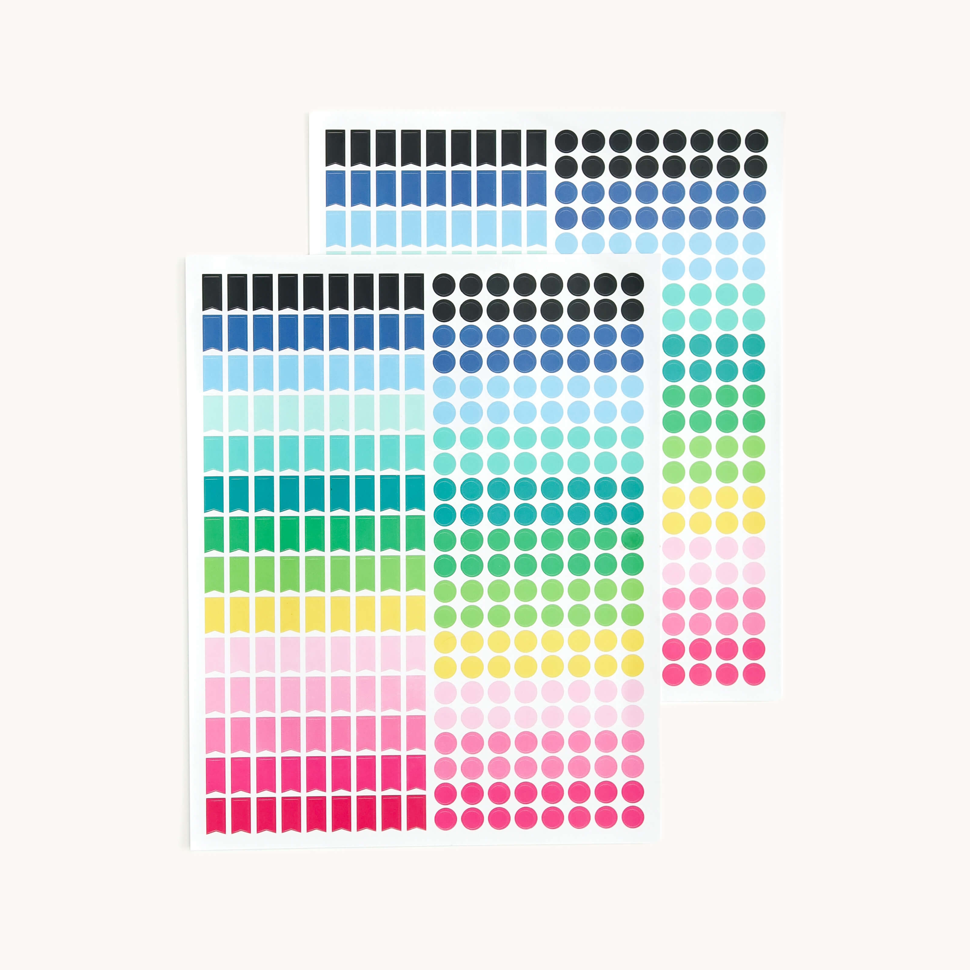 The Cling Sticker Set - Color Coding by Simplified includes two colorful sheets ideal for your acrylic wall calendar. Each sheet has small square stickers at the top and gradient round dots below, shifting from blue to pink, making it a vibrant organizing tool.