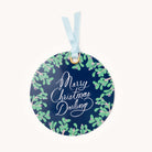 The Gift Tag Set - Merry Christmas Darling by Simplified features a round, dark blue ornament with a light blue ribbon. Adorned with green mistletoe and Merry Christmas Darling in white script, it adds charm and personalization to your gifts.