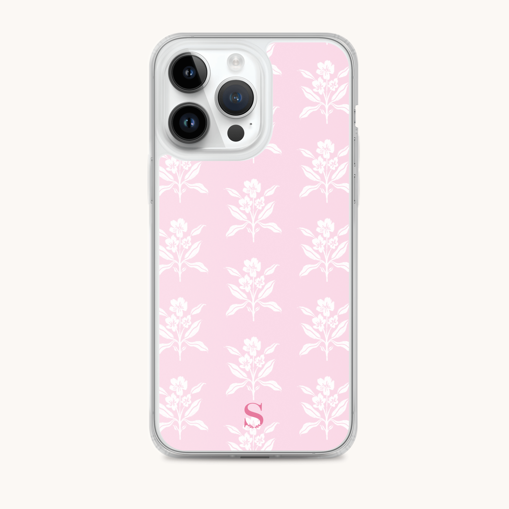 The iPhone Case - Blush Block by Simplified is a stylish pink cover with a delicate white floral design. It features a bold red S at the bottom, offering both protection and fashion.