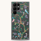 The Samsung Case - Midnight Chinoiserie by Simplified features a protective, transparent design showcasing a tree with green branches, colorful birds, flowers, leaves, and a pear against a gray background.