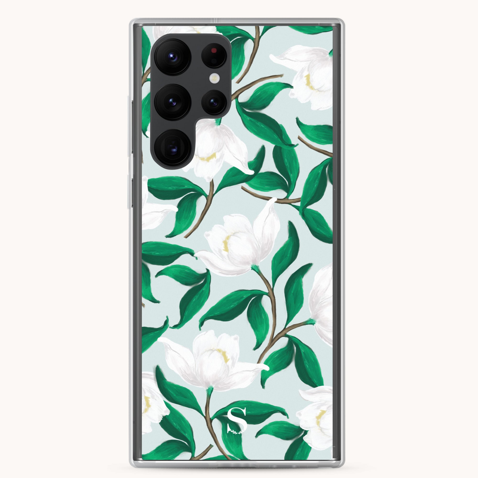 The Samsung Case - Savannah Blooms by Simplified offers a stylish design featuring white flowers and green leaves on a light green background. The robust camera cutout ensures easy capturing of moments while keeping your phone protected.