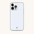 The Simplified iPhone Case - Coastal Stripe boasts a stylish design with vertical light blue and white stripes and an S at the bottom center, enhancing your phones look. Featuring three camera lens cutouts on a white background, it combines flair and protection.